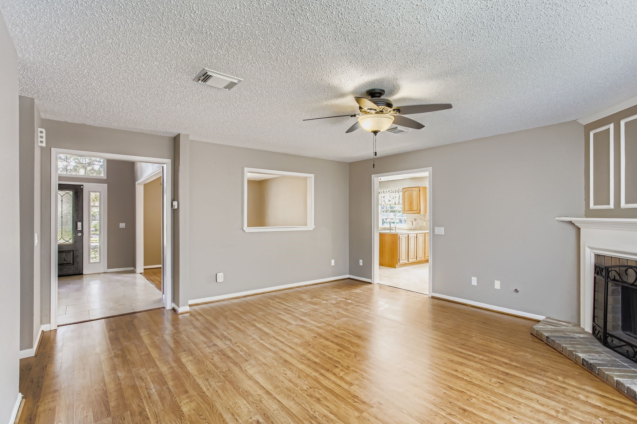 7519 Sunlight Lane Houston, TX 77095 - Photo 8 of 27 wooden floor in an empty room with a window