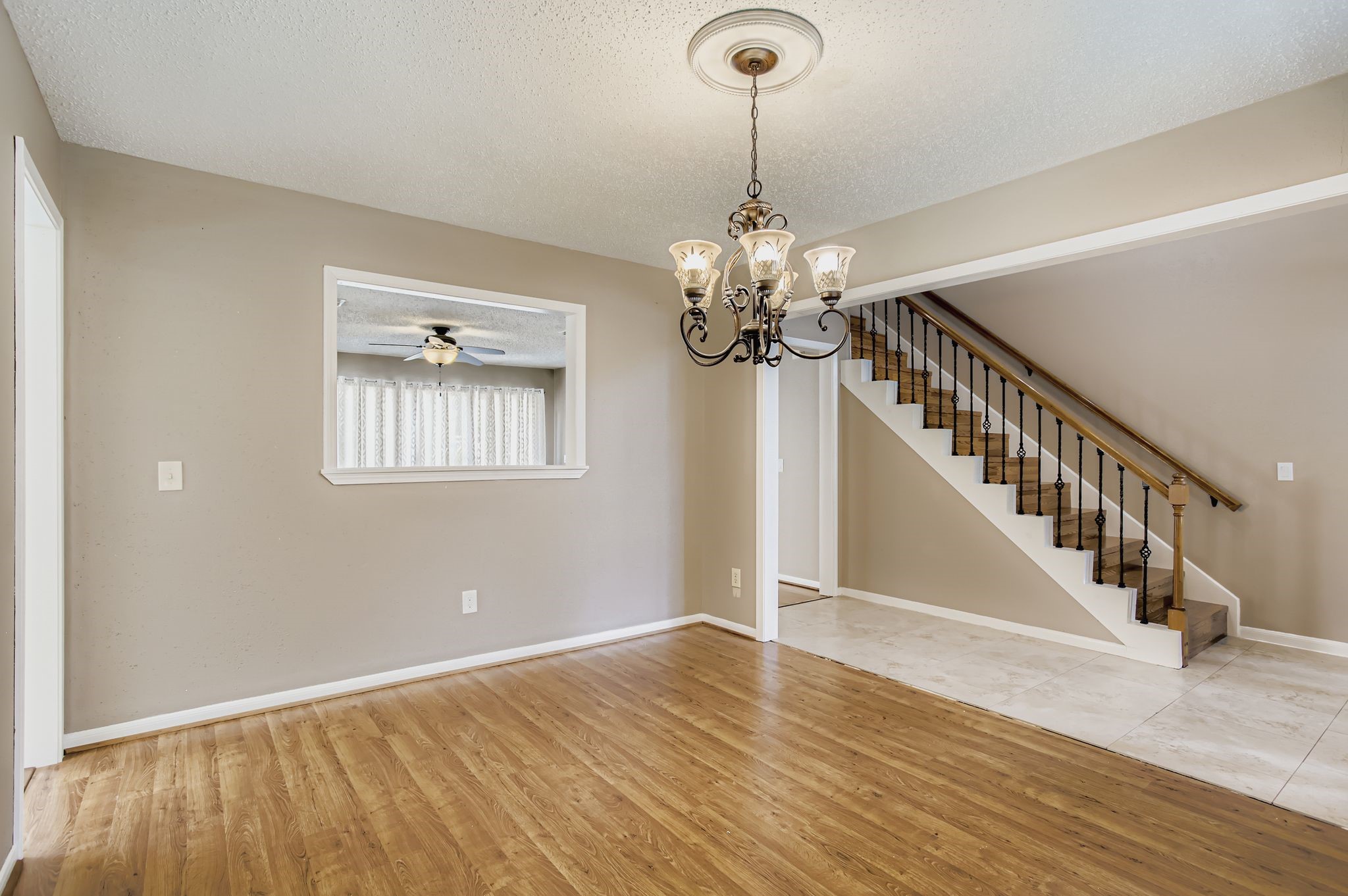 7519 Sunlight Lane Houston, TX 77095 - Photo 10 of 27 a view of an room with wooden floor chandelier and entryway