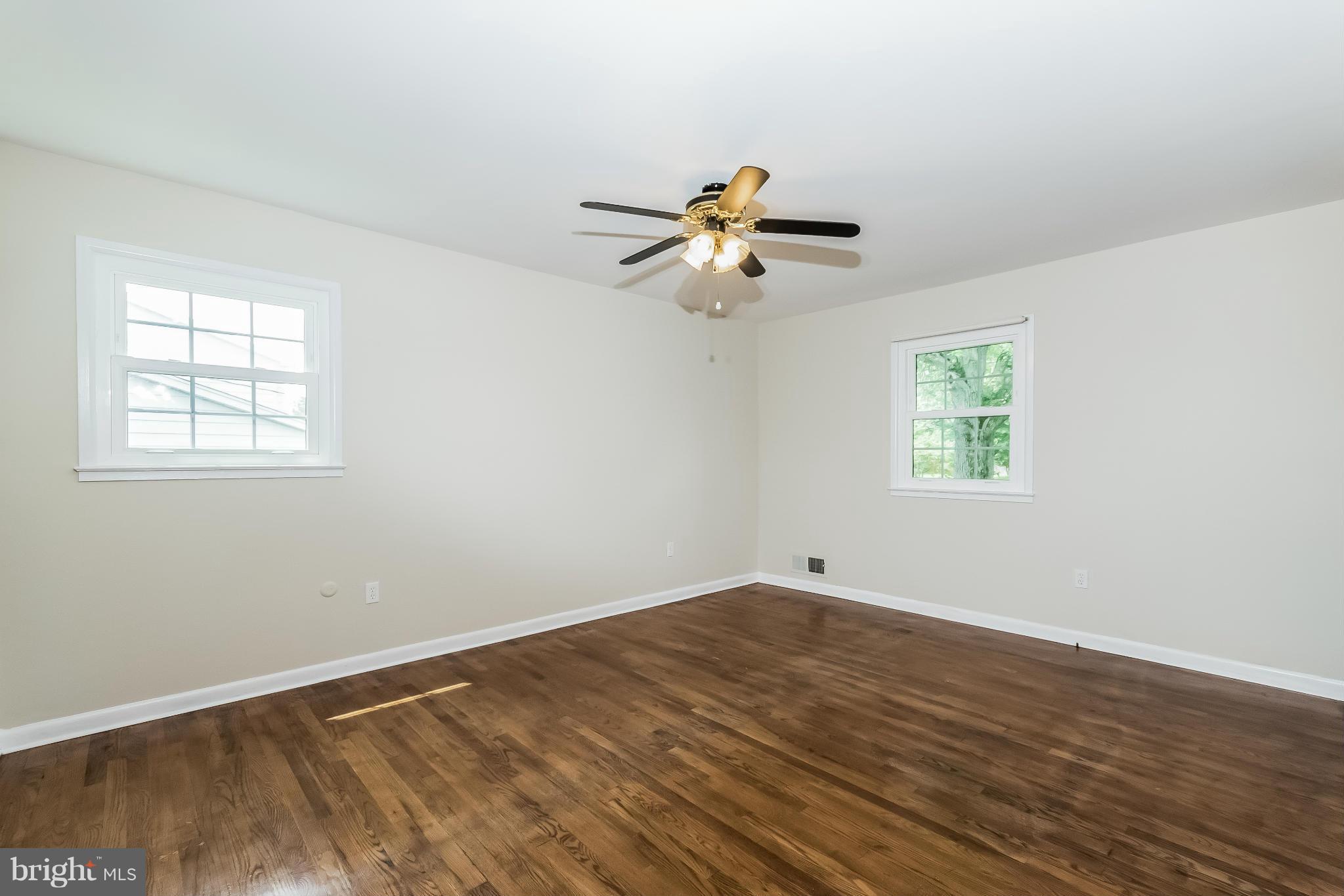 14517 Cobblestone Drive Silver Spring, MD 20905 - Photo 11 of 30 a view of empty room with wooden floor