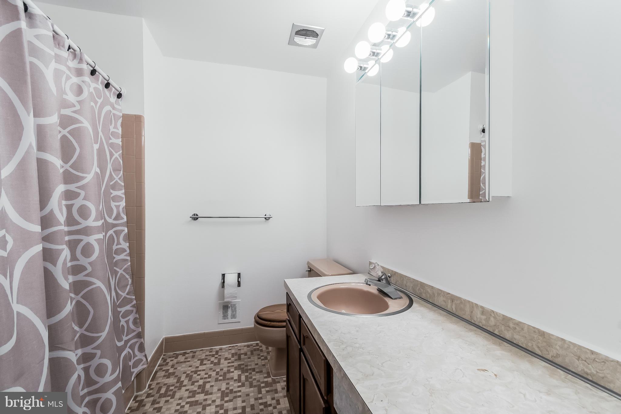 14517 Cobblestone Drive Silver Spring, MD 20905 - Photo 17 of 30 a bathroom with a sink and vanity