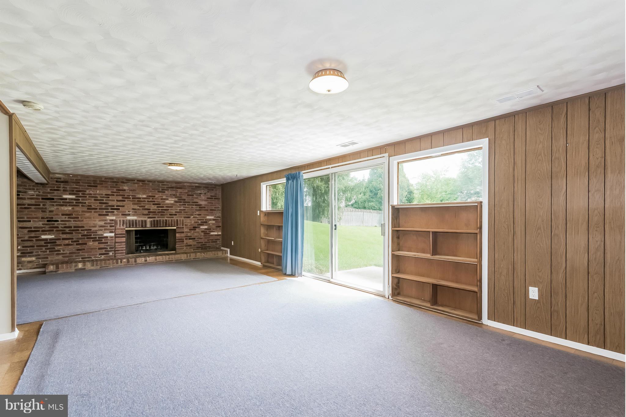 14517 Cobblestone Drive Silver Spring, MD 20905 - Photo 18 of 30 an empty room with furniture and a fireplace