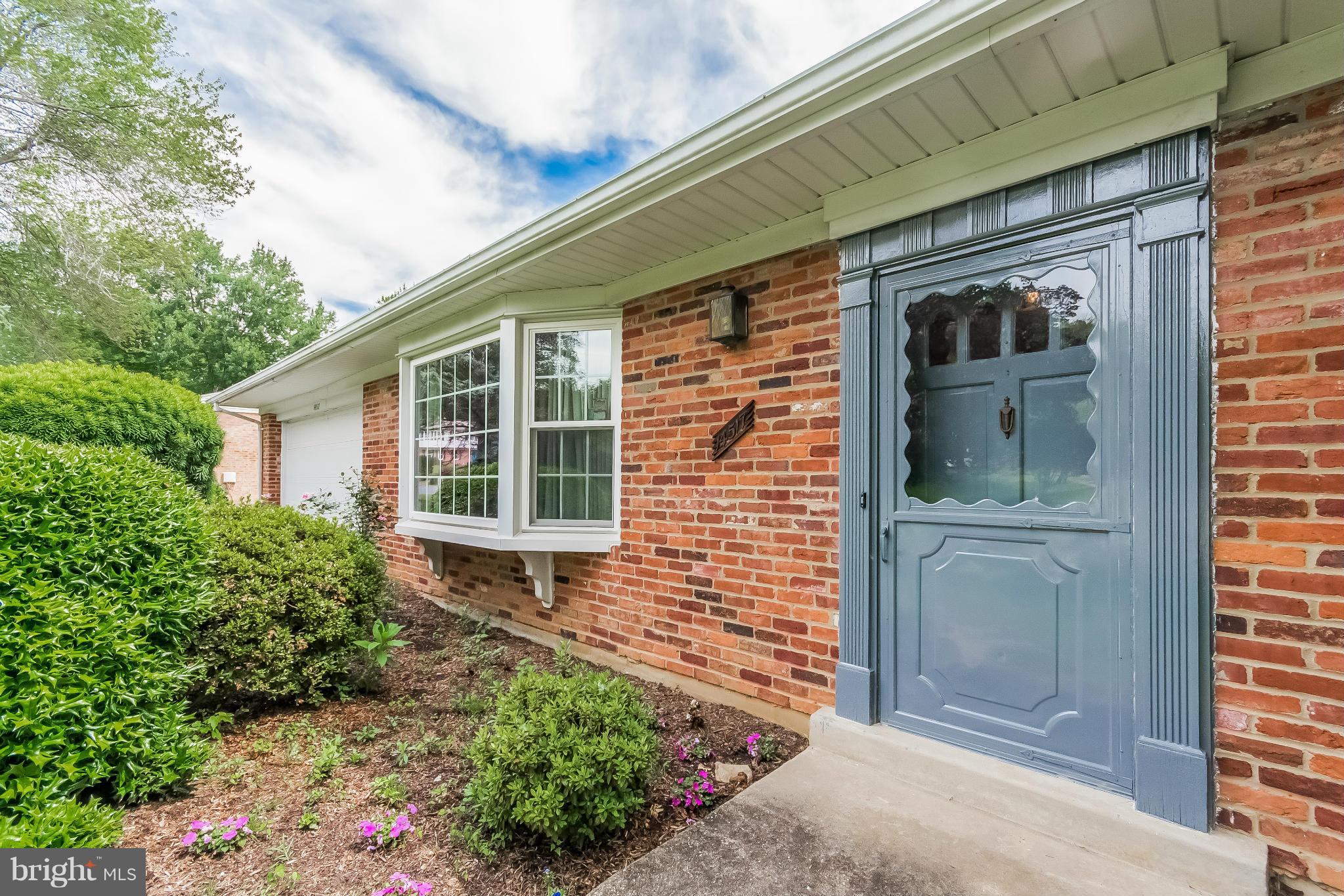 14517 Cobblestone Drive Silver Spring, MD 20905 - Photo 3 of 30 a front view of a house with a yard