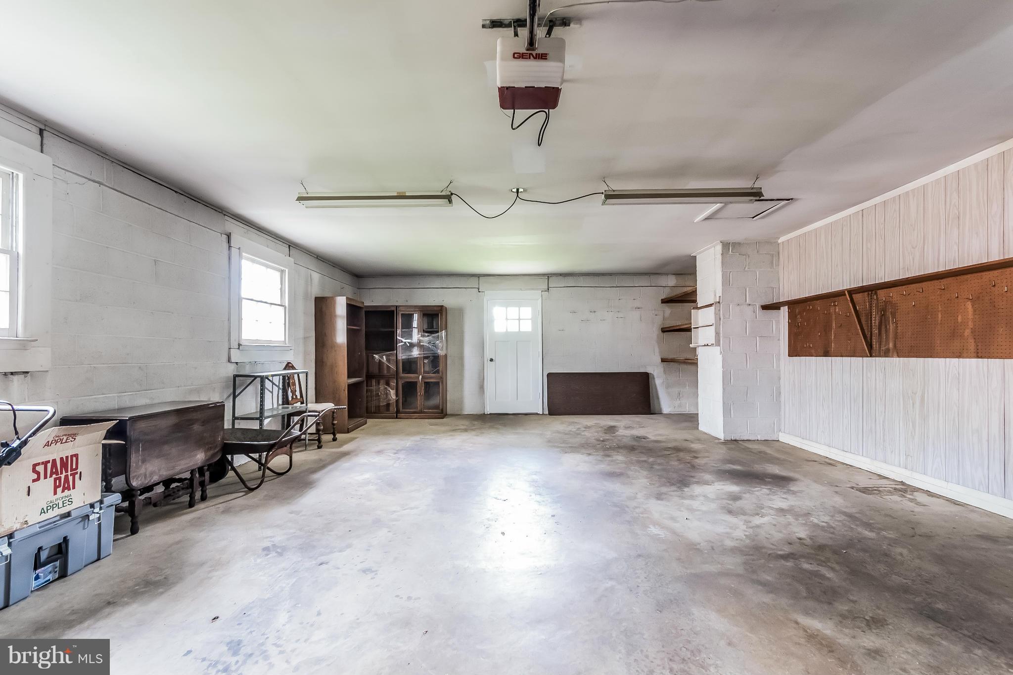 14517 Cobblestone Drive Silver Spring, MD 20905 - Photo 25 of 30 an empty room with fireplace and windows