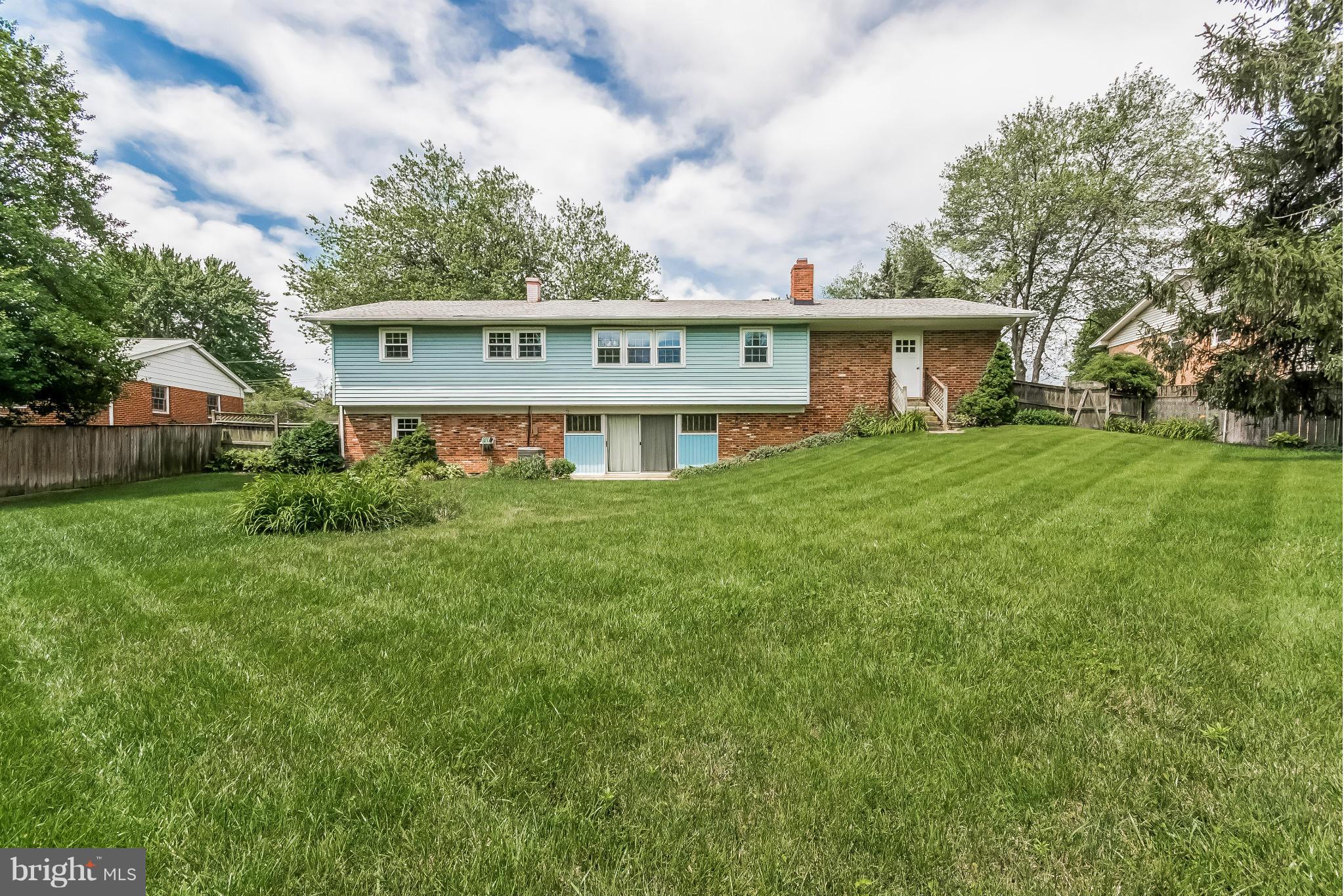14517 Cobblestone Drive Silver Spring, MD 20905 - Photo 26 of 30 a view of a house with a big yard and large trees