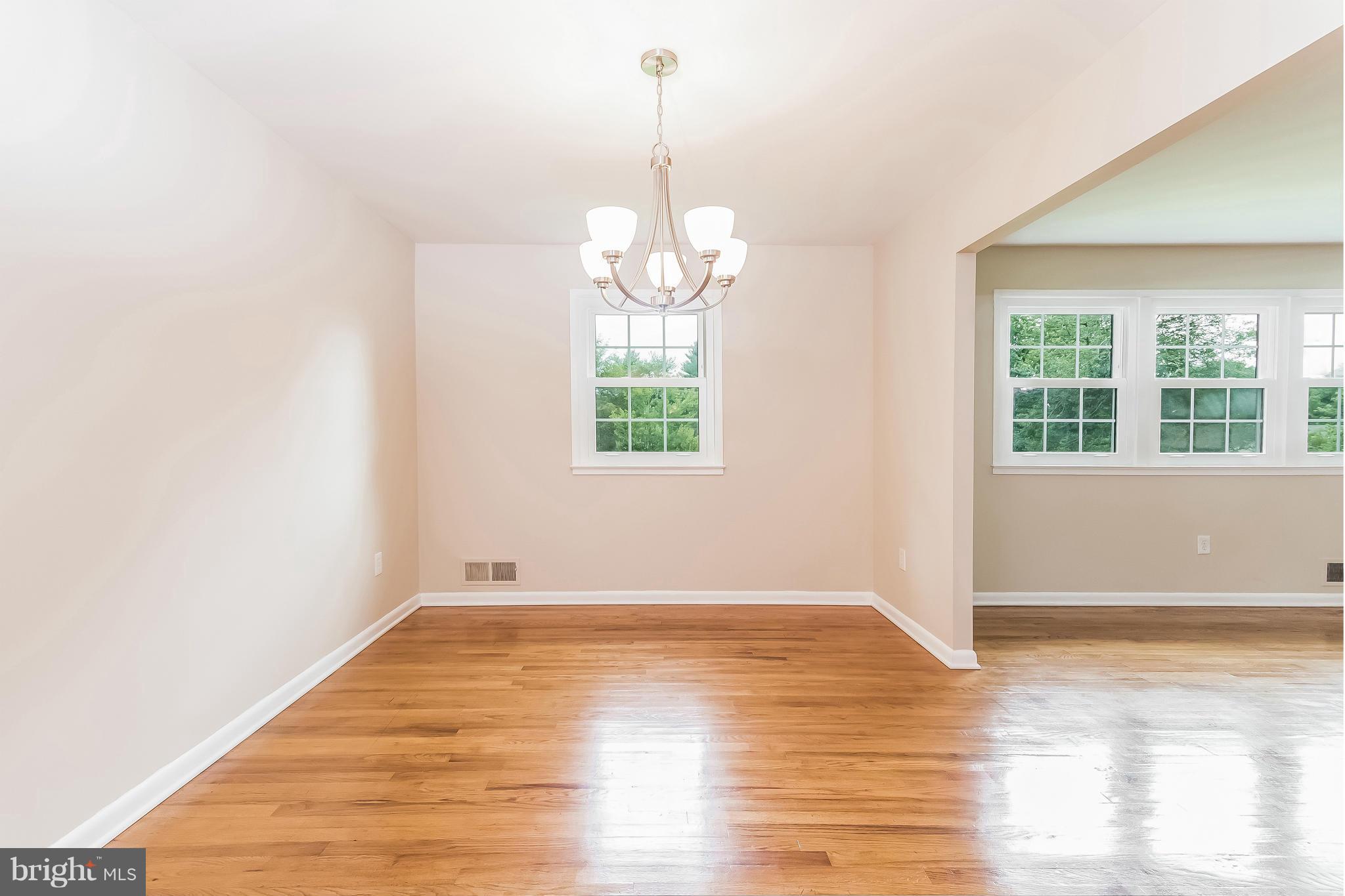 14517 Cobblestone Drive Silver Spring, MD 20905 - Photo 8 of 30 an empty room with wooden floor and windows