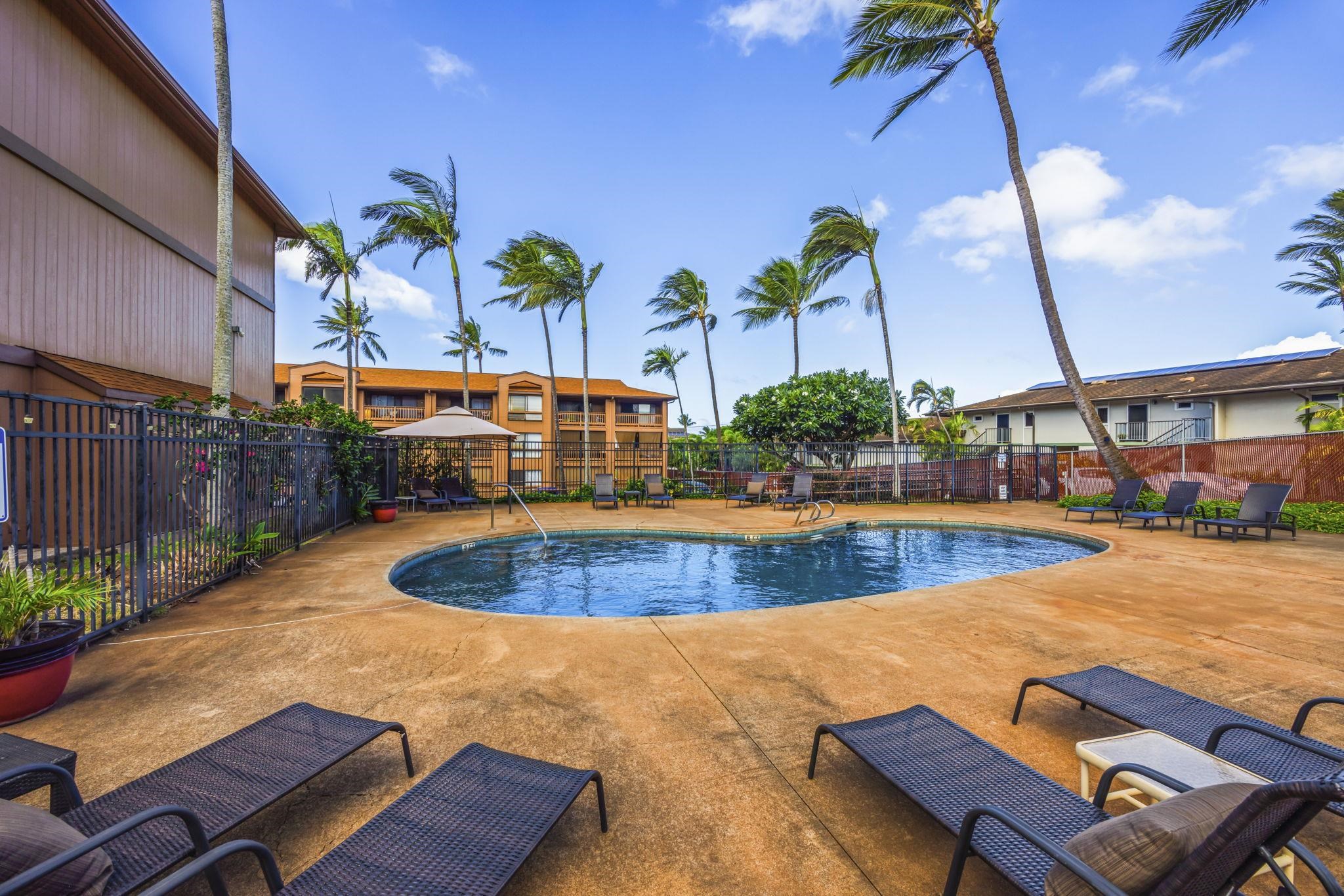 3740 Lower Honoapiilani Road, Unit F106 Lahaina, HI 96761 - Photo 18 of 28 a view of a swimming pool with a lounge chairs