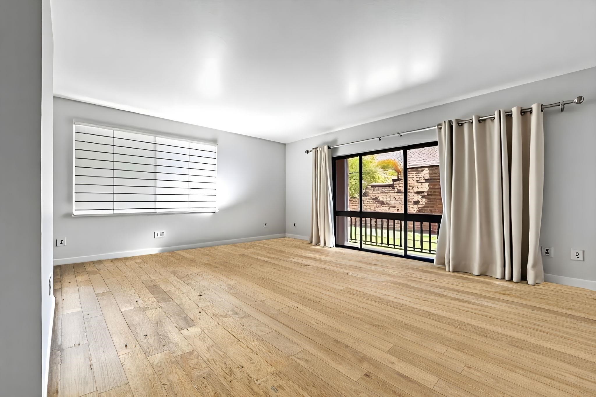 3740 Lower Honoapiilani Road, Unit F106 Lahaina, HI 96761 - Photo 6 of 28 a view of an empty room with a window and wooden floor