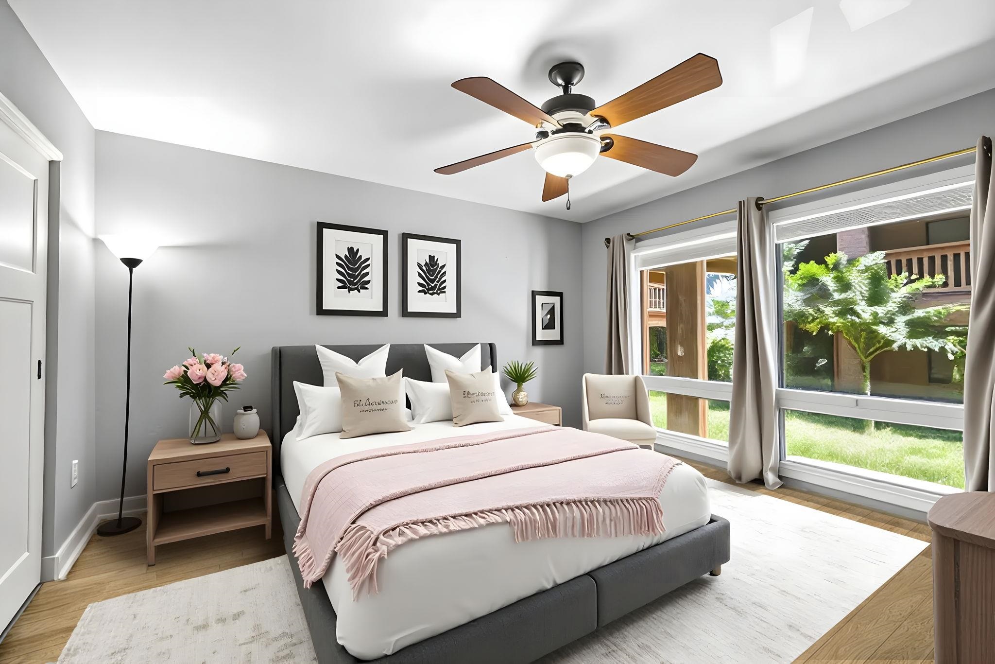 3740 Lower Honoapiilani Road, Unit F106 Lahaina, HI 96761 - Photo 7 of 28 a bedroom with a large bed and a chandelier