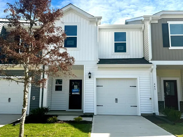 a view of house with yard