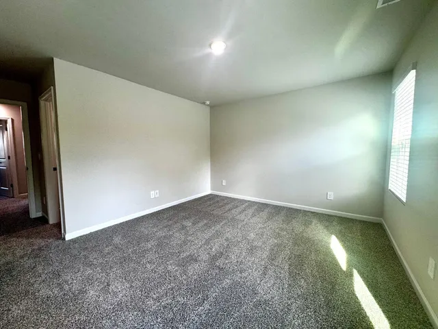 an empty room with a bathroom