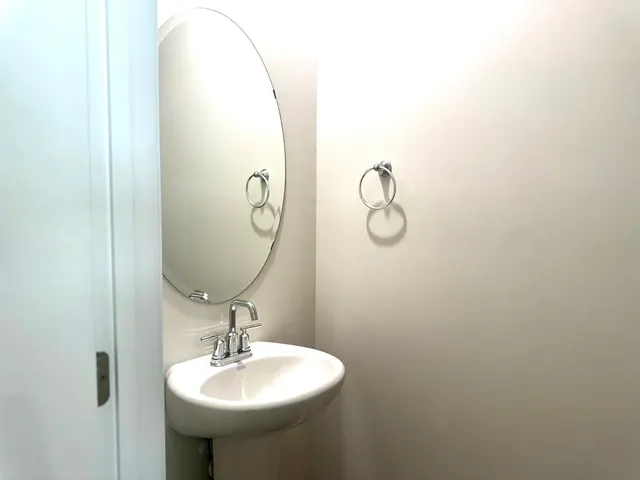 a bathroom with a sink and mirror