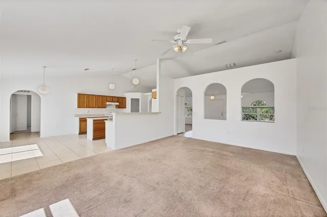 a view of an empty room and a window