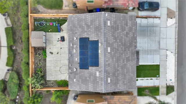 a aerial view of a house with large windows