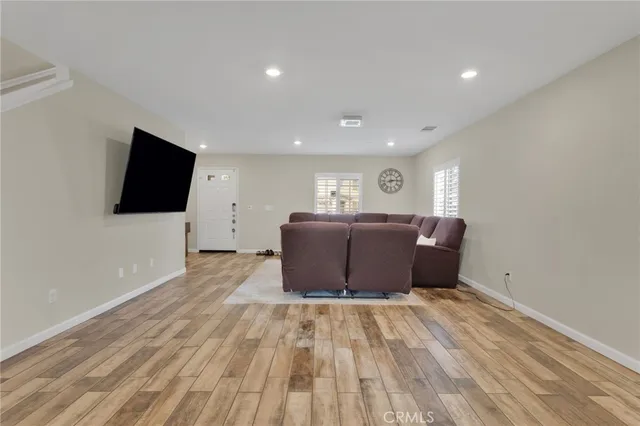 a view of a livingroom with wooden floor