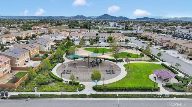 an aerial view of a house with a swimming pool yard and outdoor seating