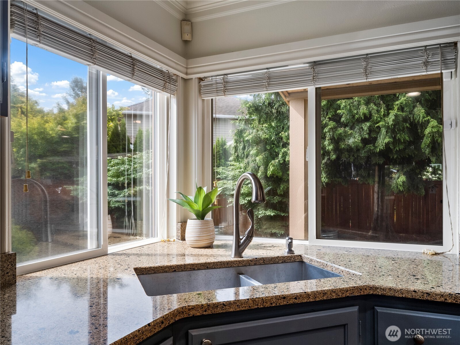 4307 Northeast 7th Place Renton, WA 98059 - Photo 9 of 39 a kitchen with granite countertop a sink and a window