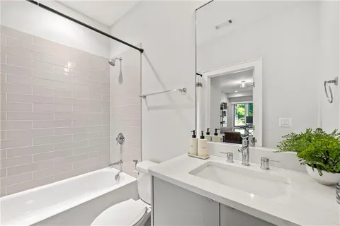 a bathroom with a sink toilet bathtub and shower