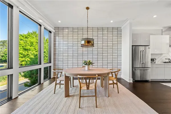 a view of a dining room with furniture window and wooden floor