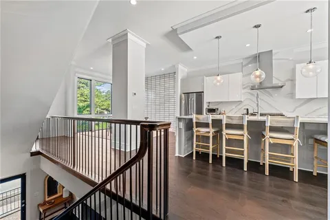 a room with wooden floor and windows