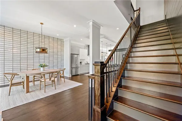 wooden floor with windows and stairs