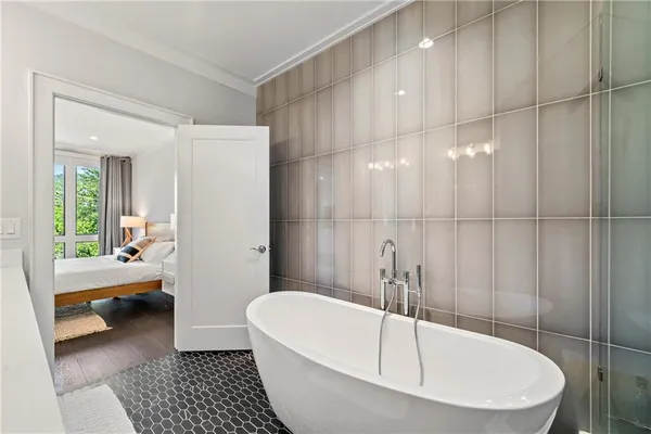 a bathroom with a bathtub and a shower