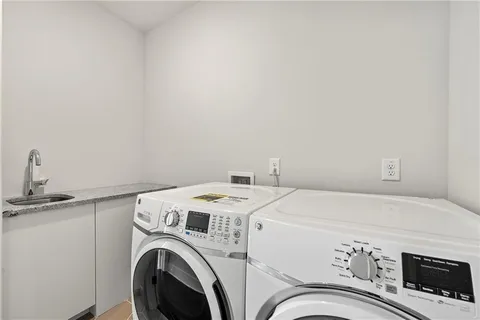 a utility room with dryer and washer