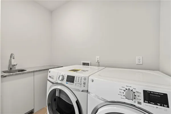 a utility room with dryer and washer