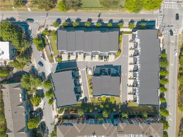an aerial view of houses with outdoor space