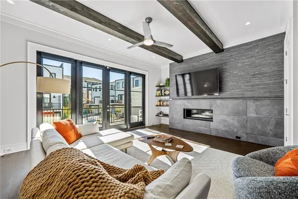 a bedroom with furniture and a flat screen tv