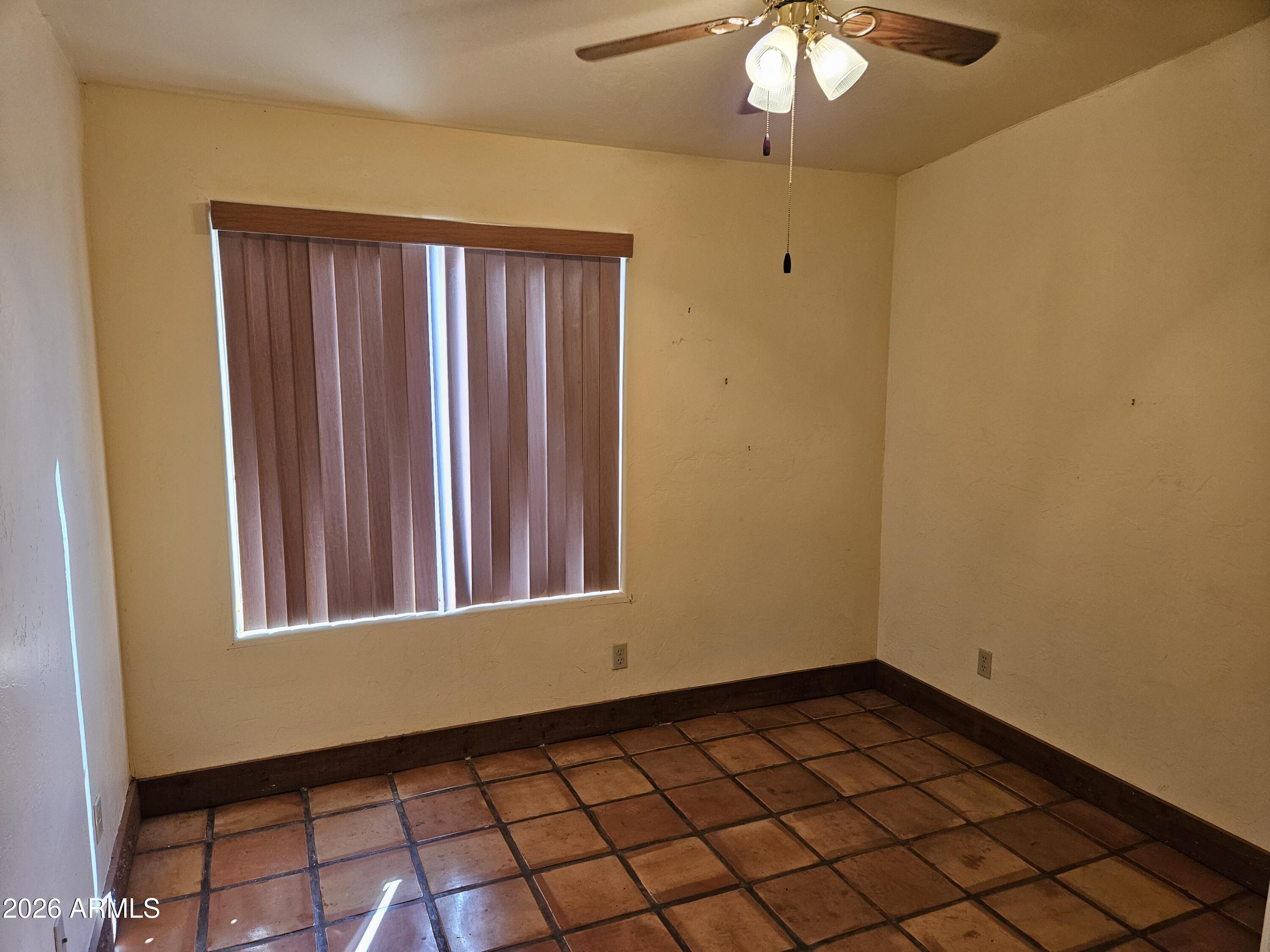 4105 North Washington Avenue Douglas, AZ 85607 - Photo 14 of 61 a view of a room with a chandelier fan and wooden floor