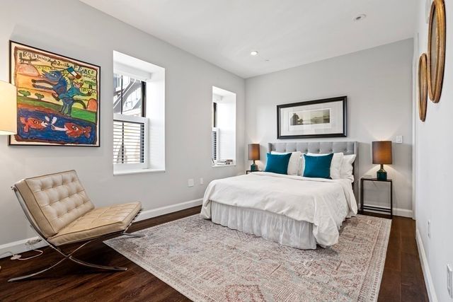 a bedroom with a bed and a couch