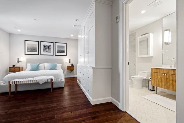 a spacious bedroom with a bed and a couch