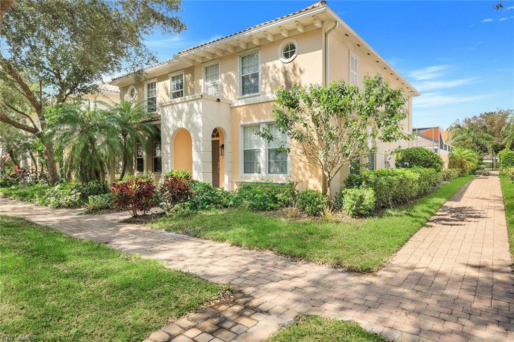 3462 Bravada Way Naples, FL 34119 - Photo 1 of 35 a front view of a house with a yard