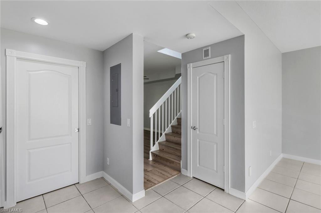 3462 Bravada Way Naples, FL 34119 - Photo 13 of 35 a view of a hallway with wooden floor and entryway
