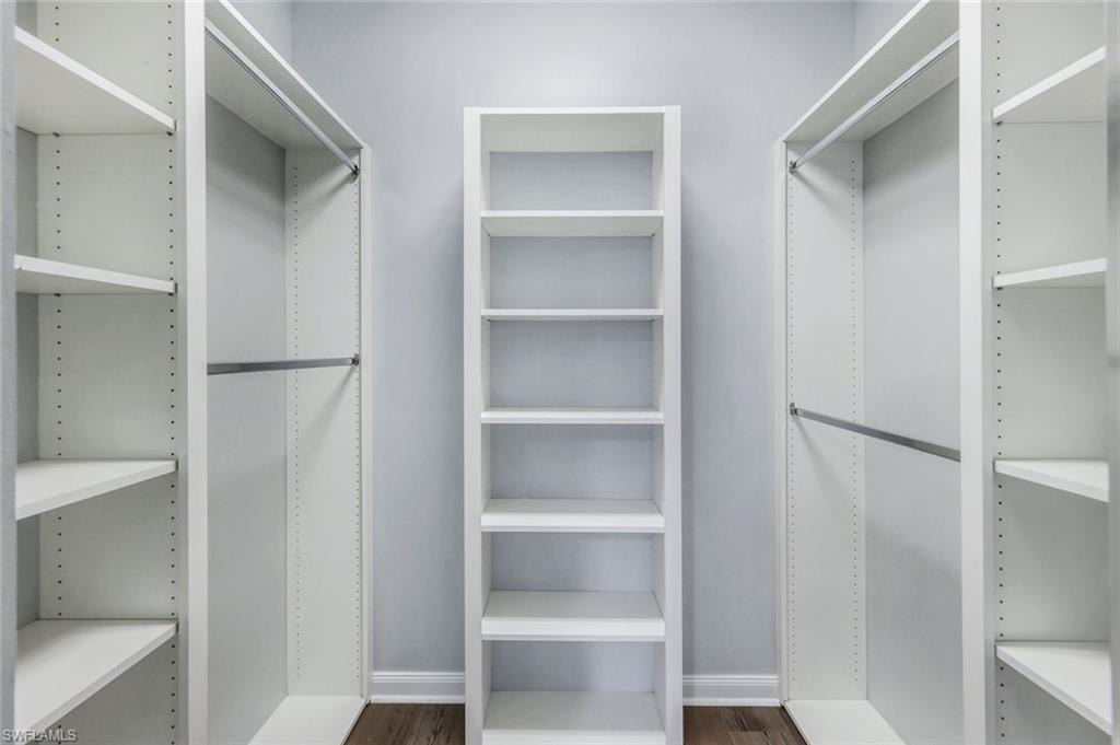 3462 Bravada Way Naples, FL 34119 - Photo 16 of 35 a view of walk in closet with empty racks