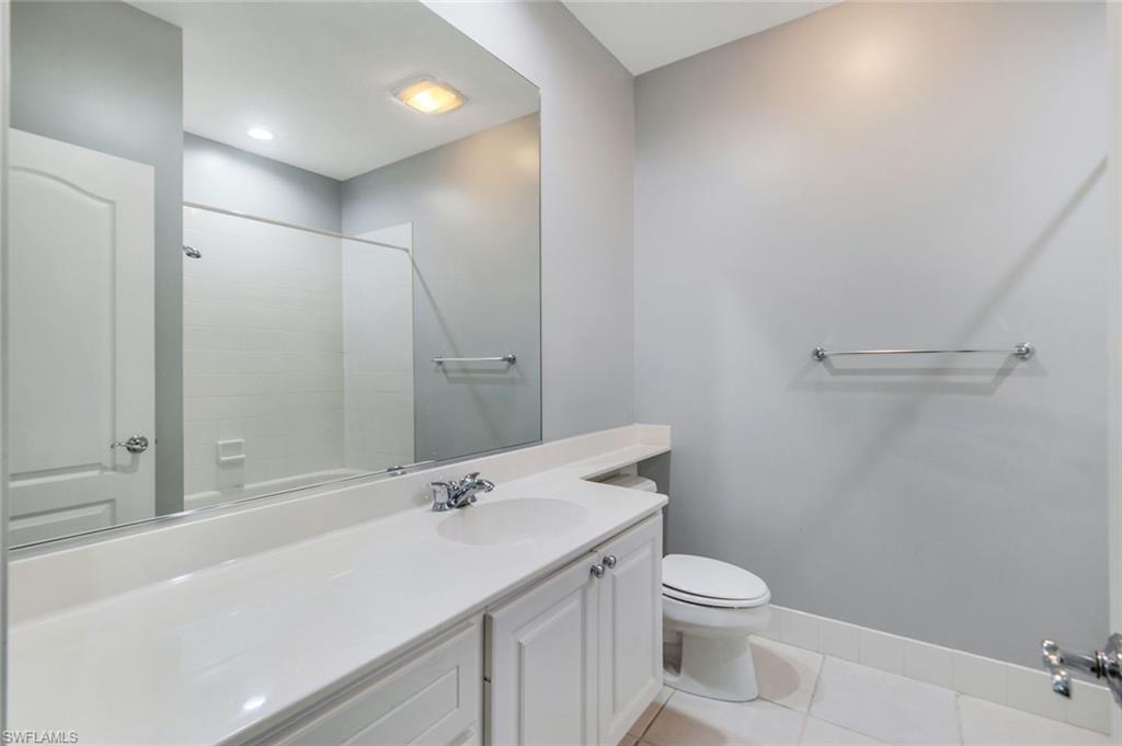 3462 Bravada Way Naples, FL 34119 - Photo 20 of 35 a bathroom with a sink a toilet and shower