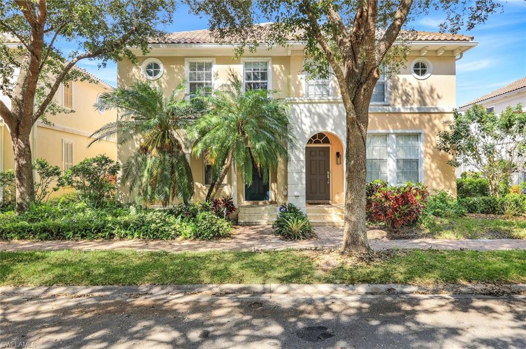 3462 Bravada Way Naples, FL 34119 - Photo 2 of 35 a front view of a house with garden
