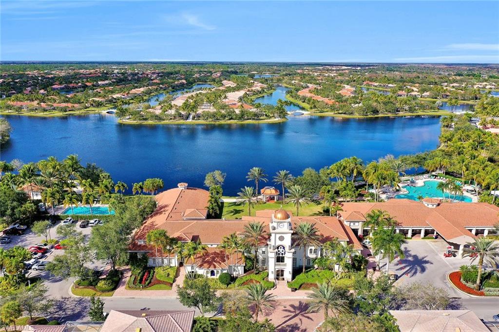 3462 Bravada Way Naples, FL 34119 - Photo 35 of 35 a view of a lake with a building in the background