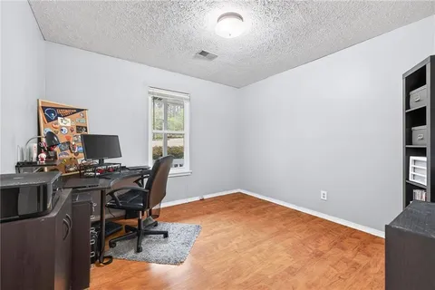 a workspace with furniture and window