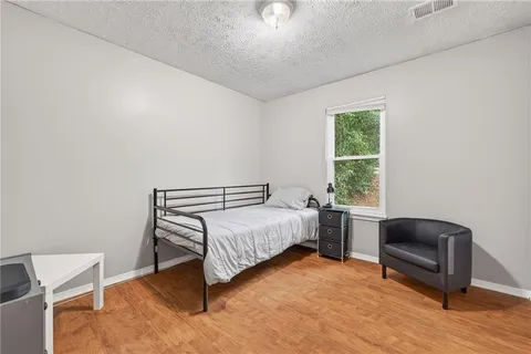 a room with a bed and a chair