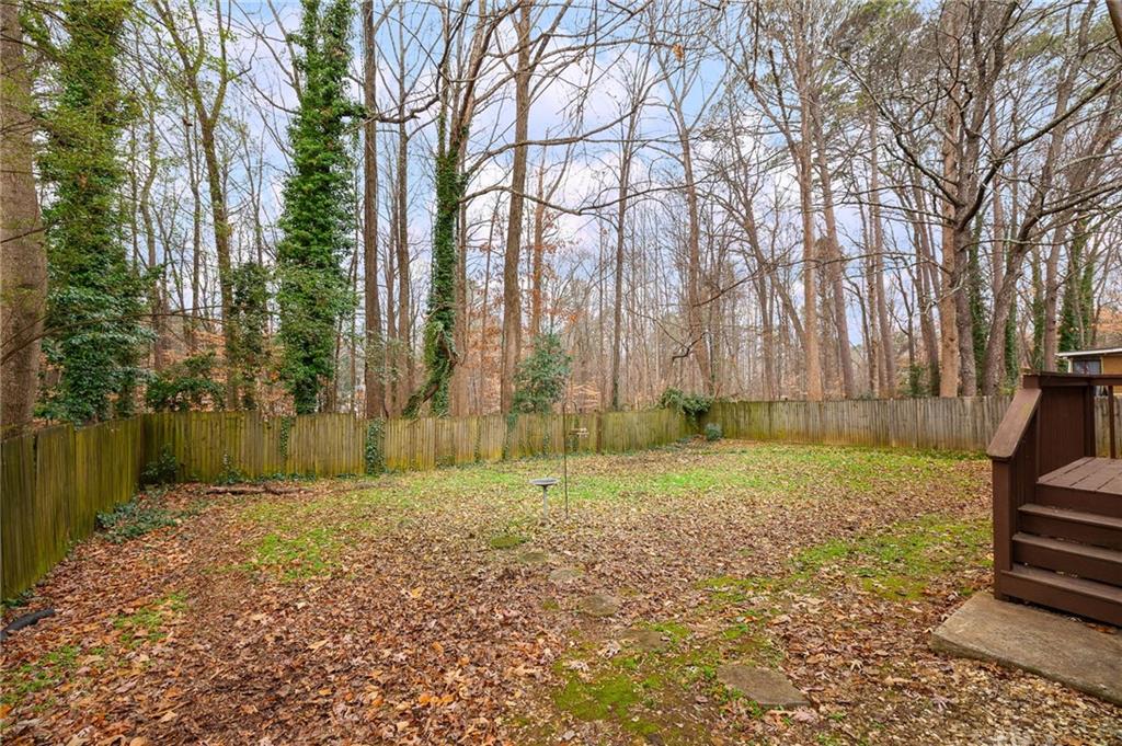 1572 Kings Ridge Drive Northwest Norcross, GA 30093 - Photo 17 of 20 a view of backyard with green space