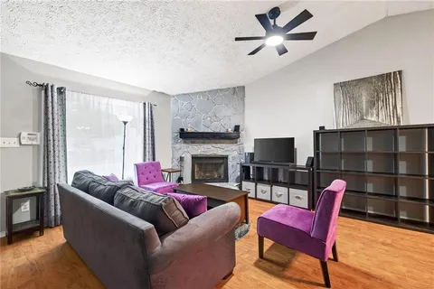 a living room with furniture a fireplace