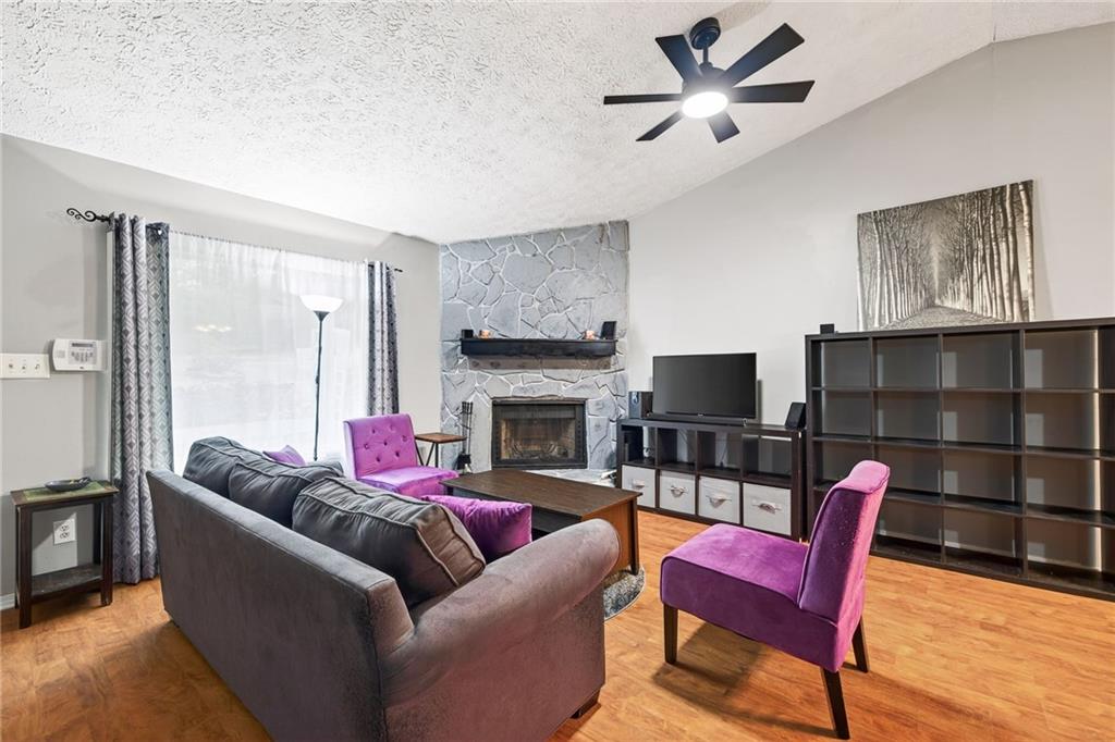 1572 Kings Ridge Drive Northwest Norcross, GA 30093 - Photo 3 of 20 a living room with furniture a fireplace