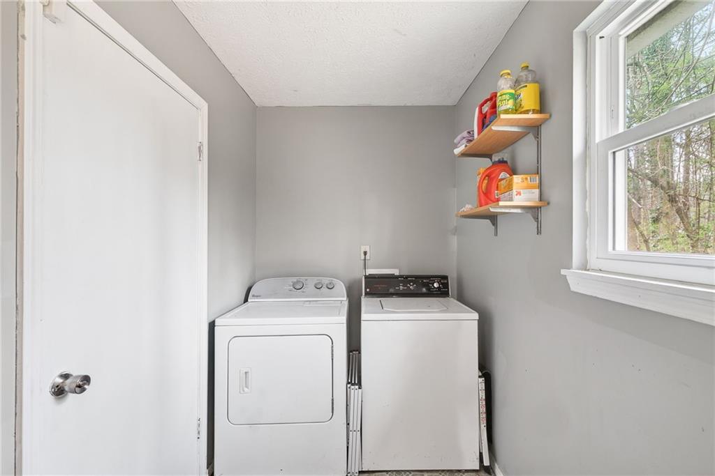 1572 Kings Ridge Drive Northwest Norcross, GA 30093 - Photo 10 of 20 a utility room with dryer and washer