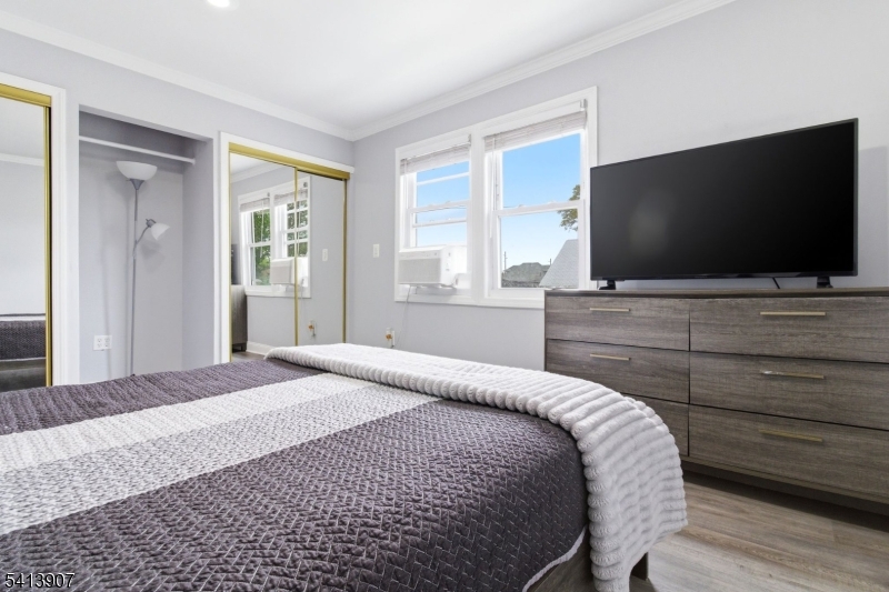 32 Cedar Avenue Elizabeth, NJ 07202 - Photo 22 of 32 a bedroom with a bed and a flat screen tv
