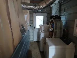 a view of a storage and utility room with furniture
