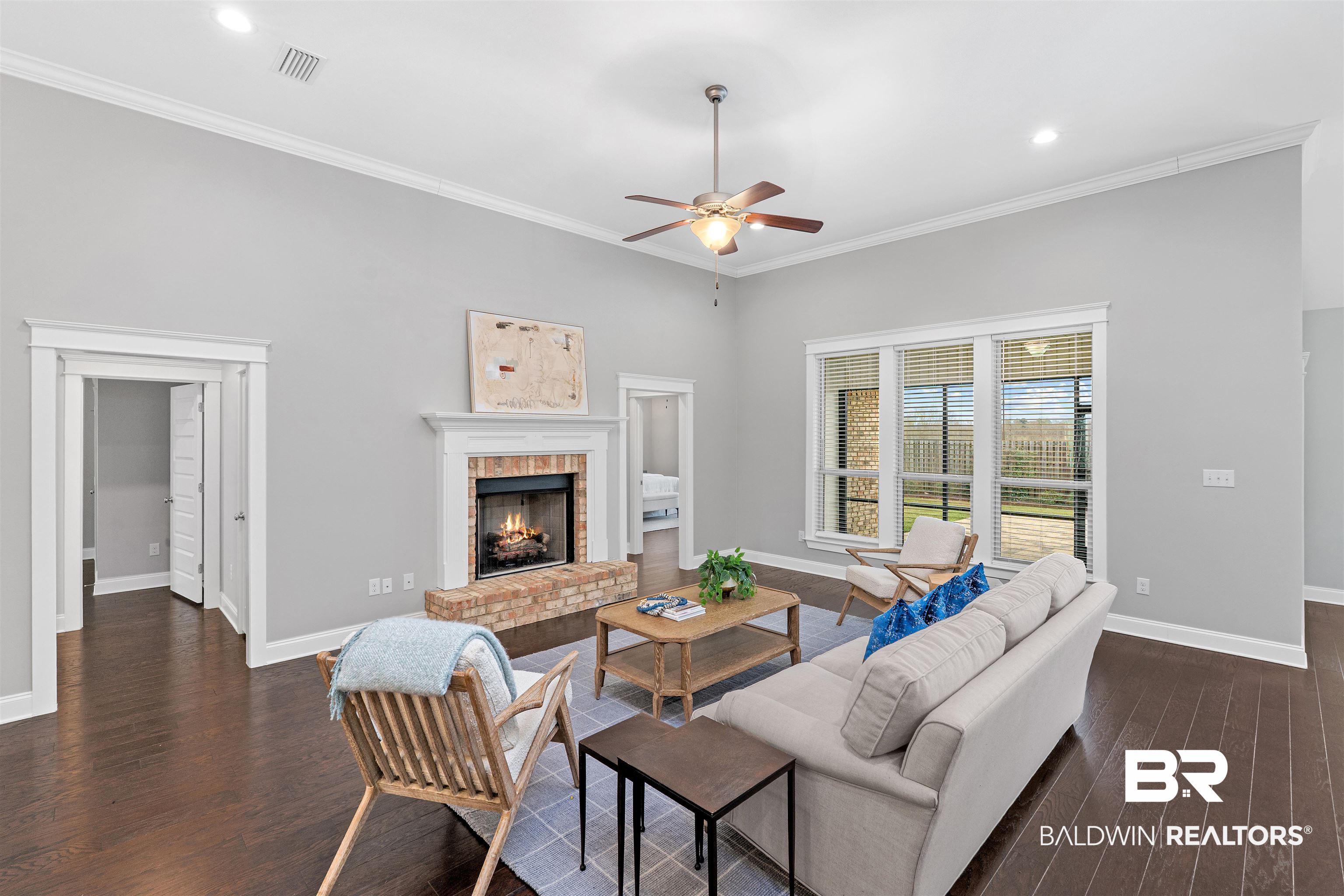 24838 Slater Mill Road Daphne, AL 36526 - Photo 6 of 46 Living area with a fireplace, dark wood-style flooring, ornamental molding, a ceiling fan, and recessed lighting