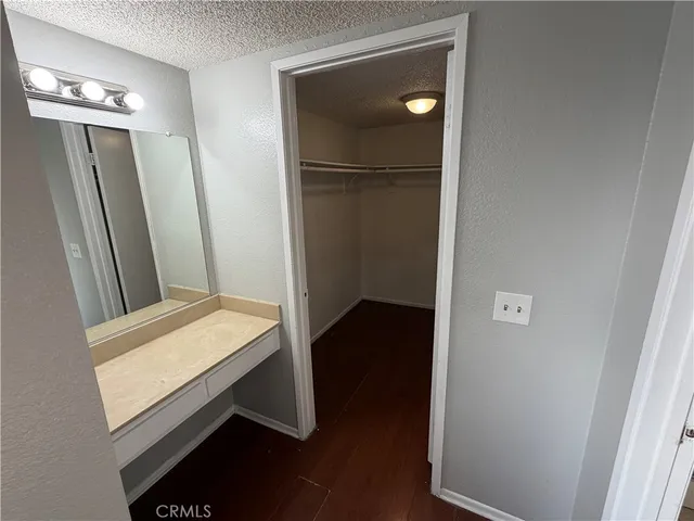 a view of bathroom with a sink and mirror