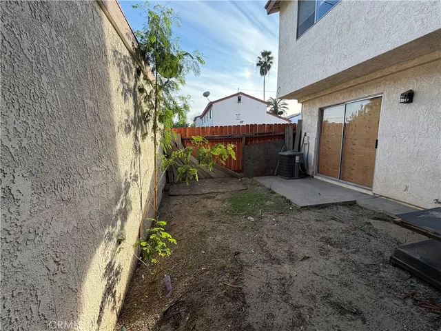 a view of a house with a small yard