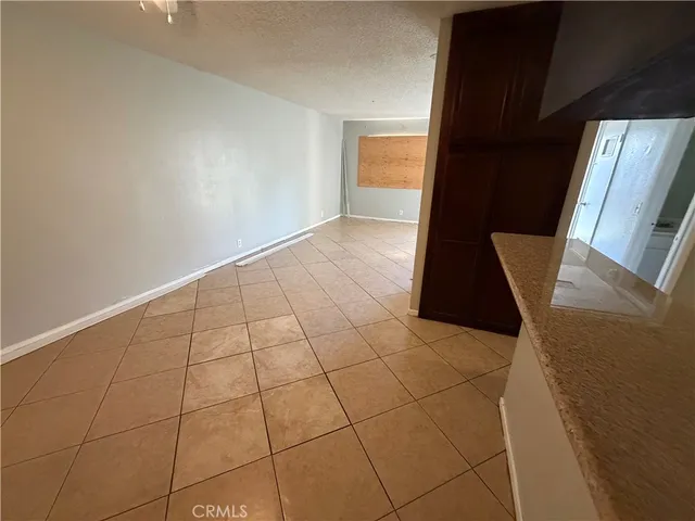 a view of an empty room with windows